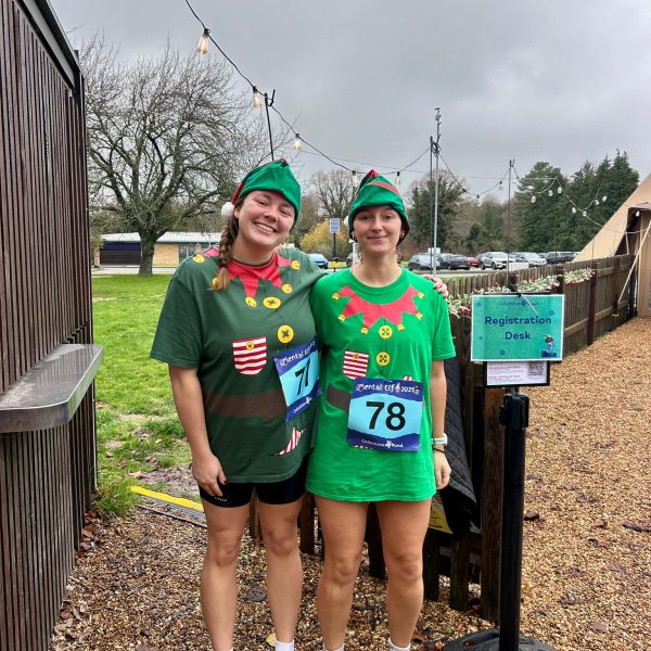 Two runners dressed as Christmas Elfs