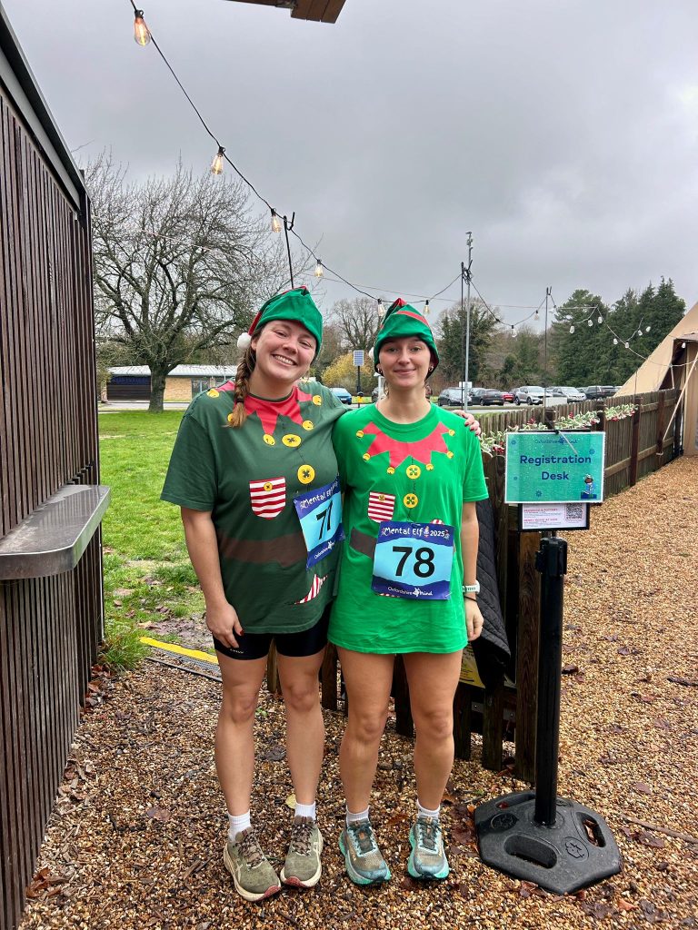Two runners dressed as Christmas Elfs